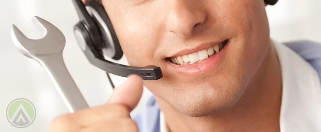 close-up-male-call-center-agent-with-wrench-technical-support-concept