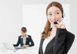 female-chinese-call-center-agent-boss-on-background