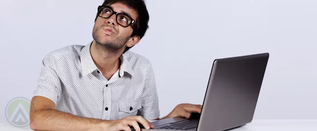 thinking-male-image-moderator-in-front-of-laptop