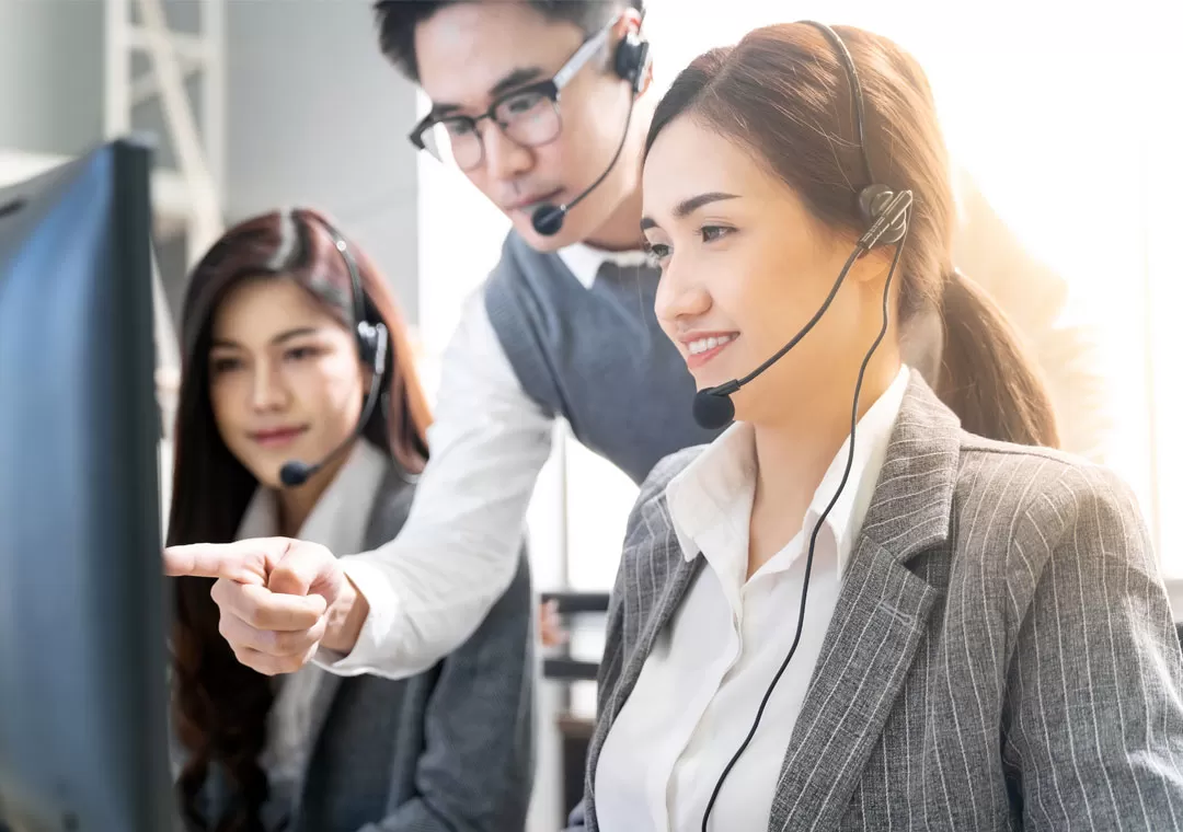 call quality monitoring depiction team leader listening to customer service call center calls for quality assurance