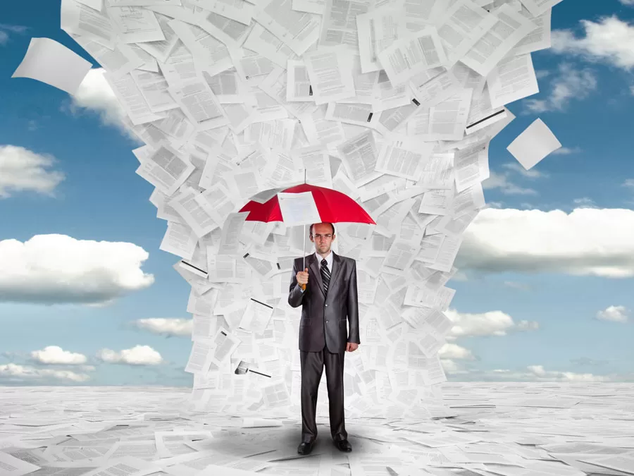content moderation analyst under umbrella under raining paper documents