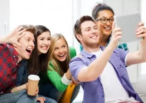 group-millennial-taking-selfie-with-tablet