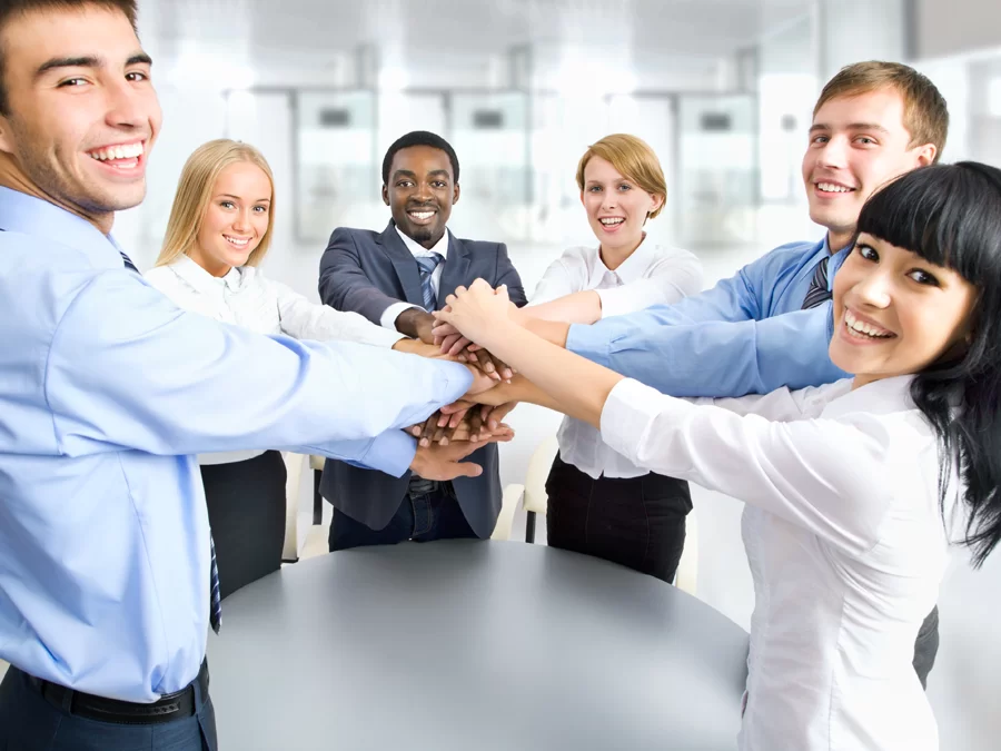 call center team holding hands showing teamwork 