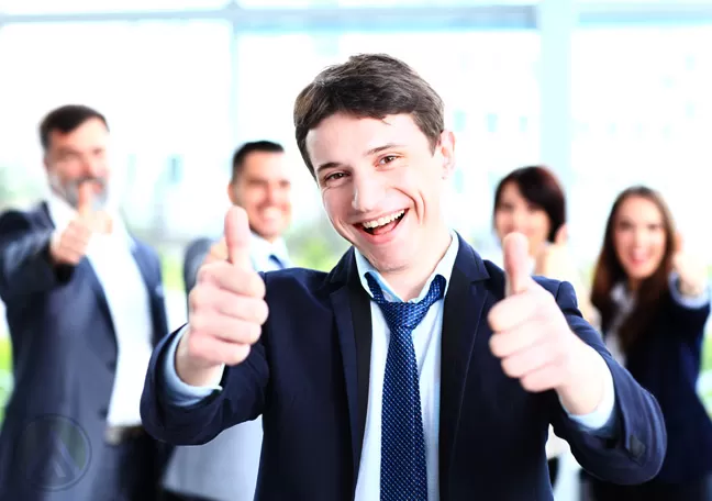 male-businessman-thumbs-up-coworkers