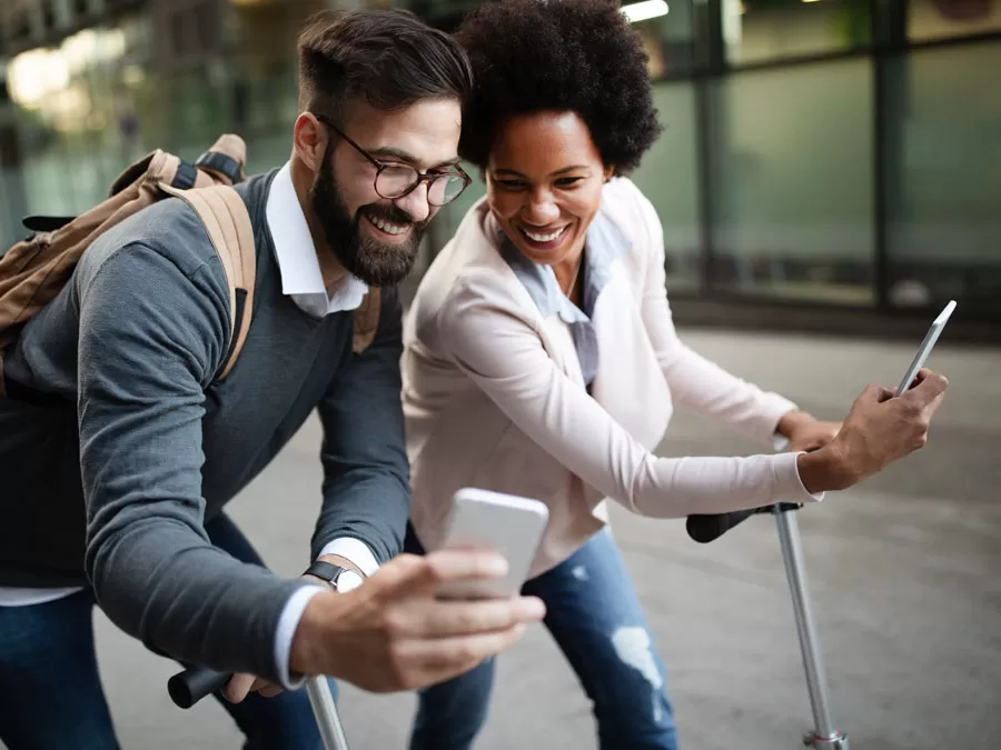 multicultural couple with online customer service agent on smartphone call