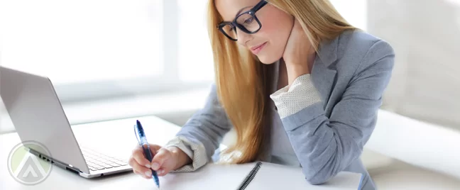 blonde-young-woman-in-blue-blazer-using-laptop