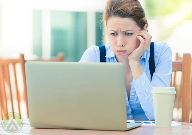 disappointed-woman-looking-at-laptop