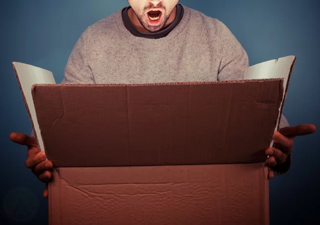 man-surprised-looking-into-big-box