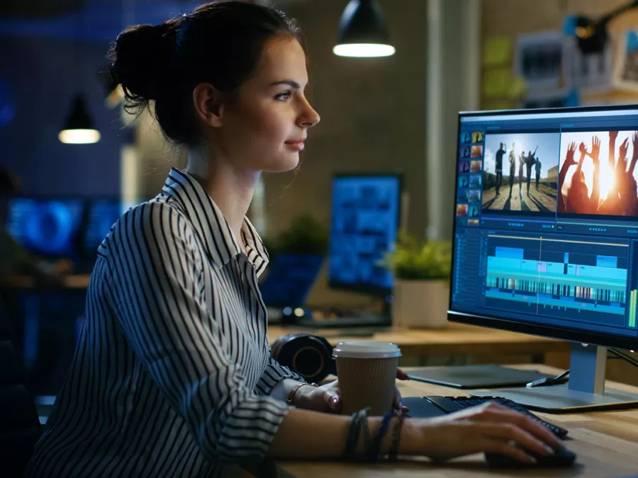 online video producer editing footages on computer
