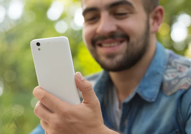 bearded-man-using-smartphone-outdoors