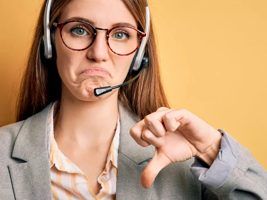 disappointed customer service agent giving thumbs down 