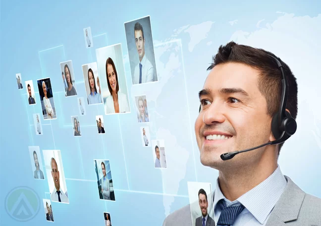 smiling-male-call-center-agent-looking-at-photos-in-virtual-interface