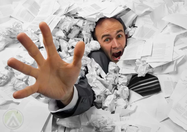 businessman-drowning-in-paper-work