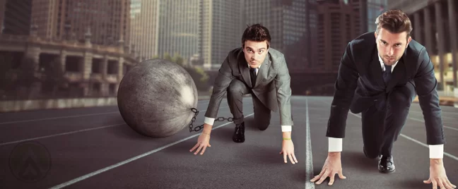 businessmen-running-in-street-with-ball-chain