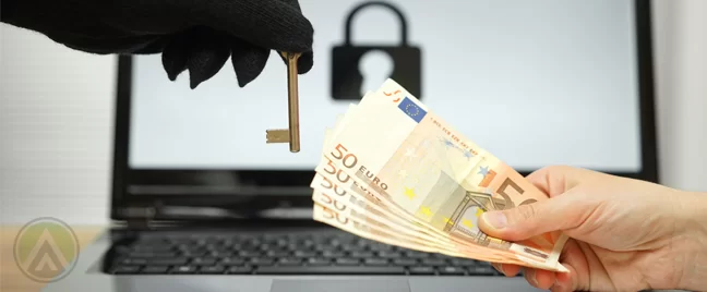 hand-holding-euros-money-to-gloved-theft-with-key-laptop-in-back