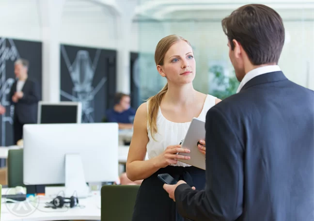 female employee chatting with boss