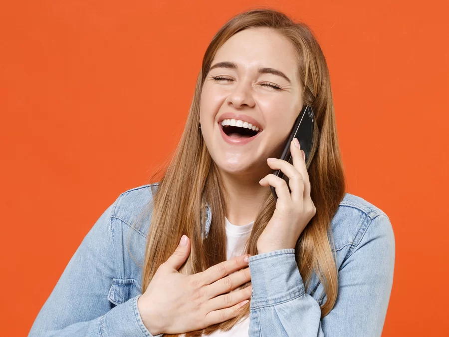 delighted woman on the phone