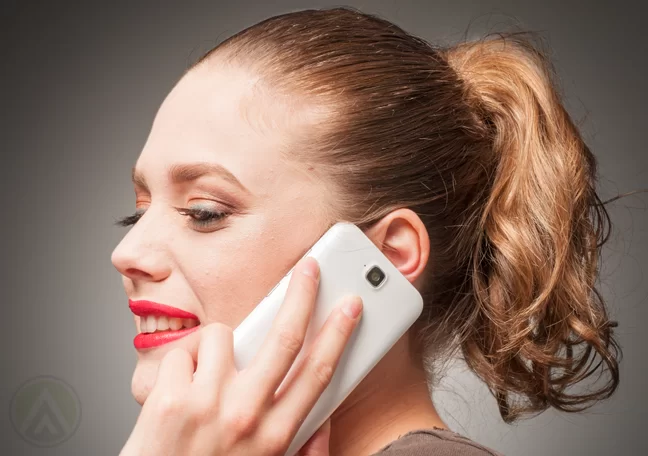 close up woman talking on smartphone