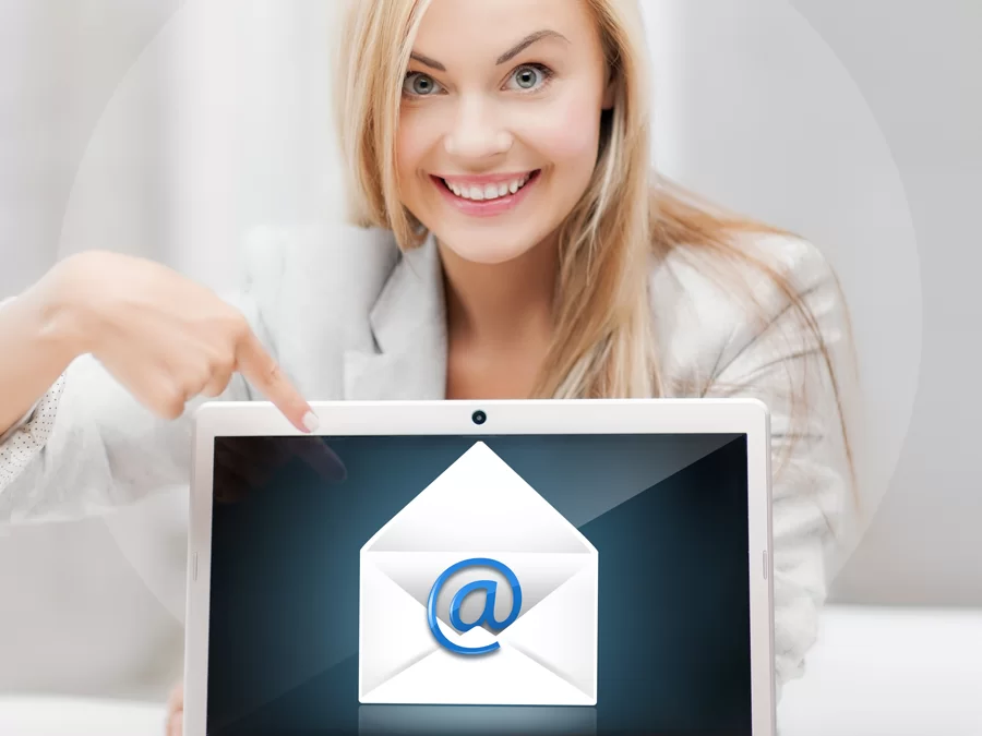 great customer service email CX support agent pointing to email icon on laptop