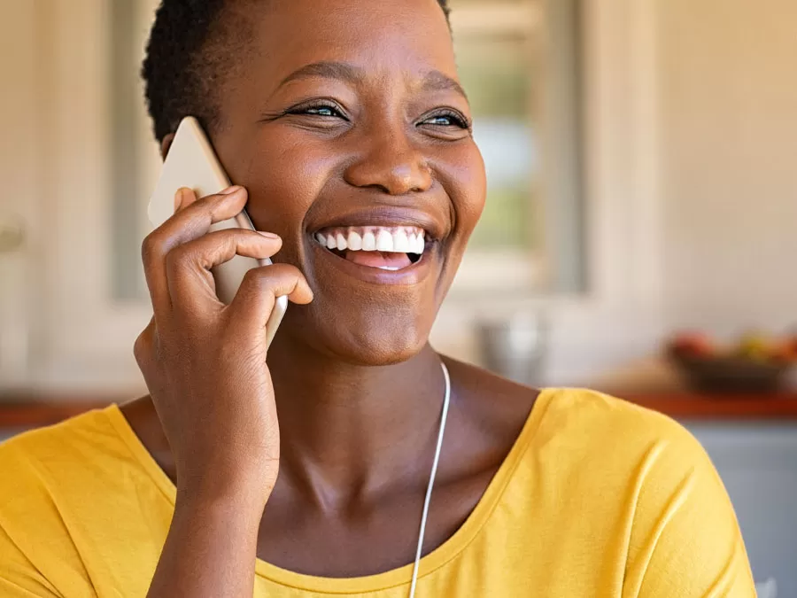 woman happily talking on phone