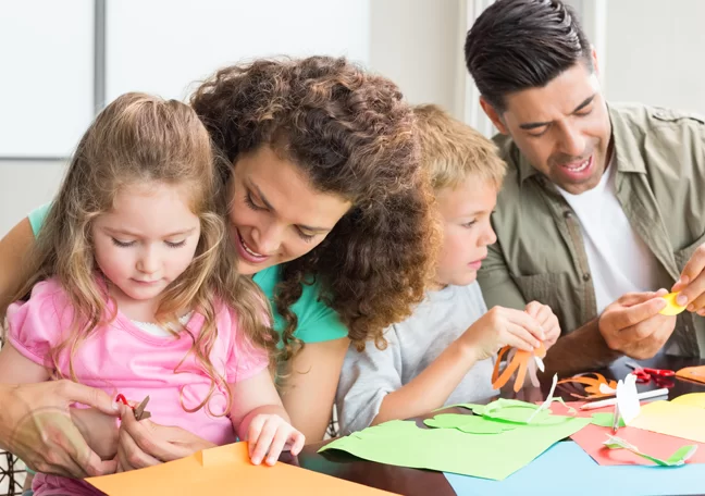 adults helping kids arts crafts