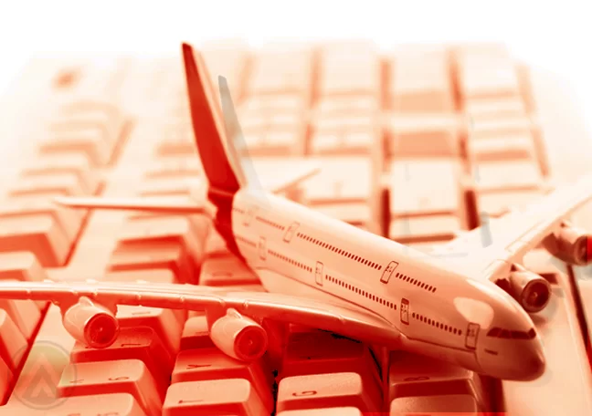 miniature airplane on white computer keyboard