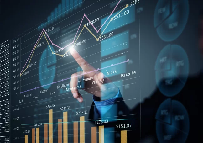 businessman pointing to data information from charts graphs on computer monitor screen