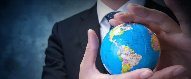 businessman holding globe