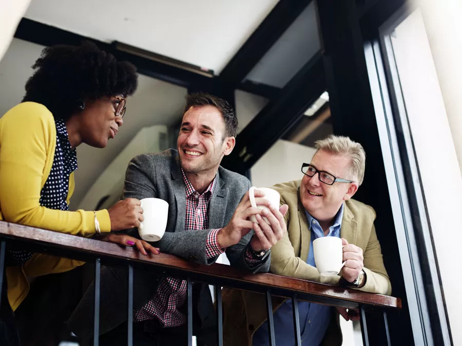 call center team leaders in discussion during coffee