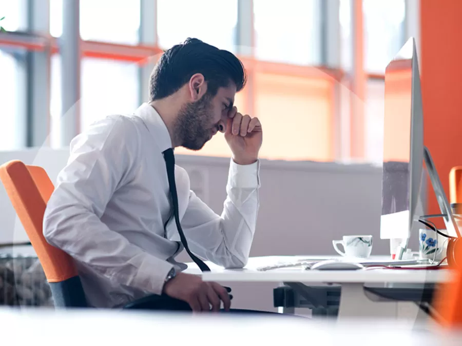 frustrated email support agent staring at computer screen