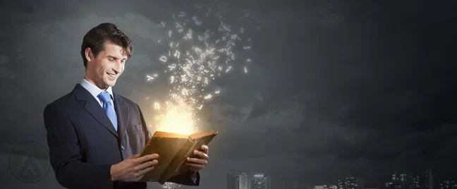 smiling businessman reading book