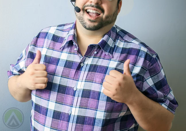chubby bearded call center agent giving thumbs up