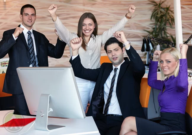 succeeding office employees arms in the air