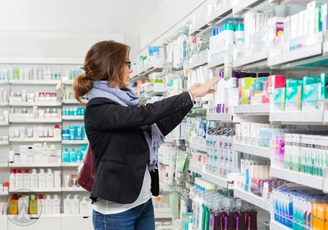 woman selecting products pharmacy