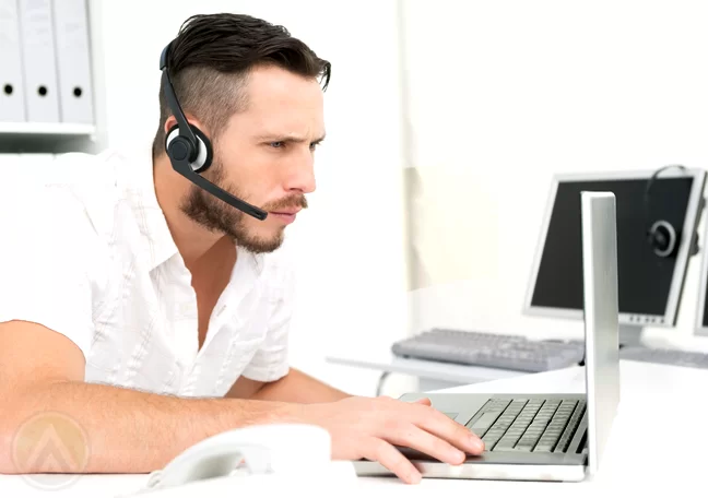 call center agent in white using laptop