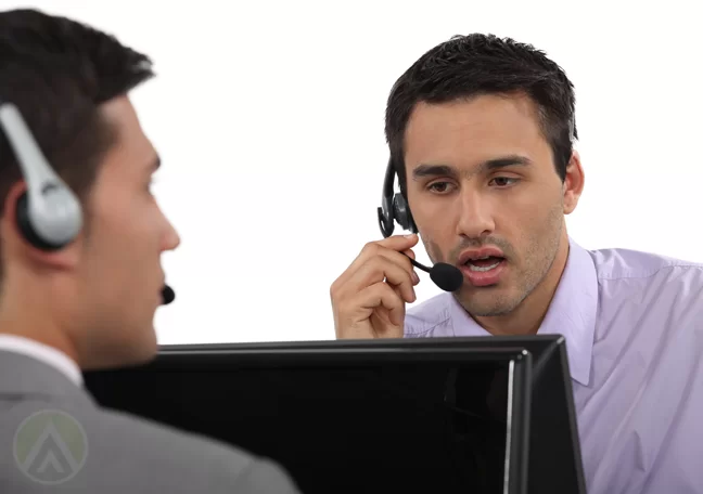 customer service agents in call center speaking on headset