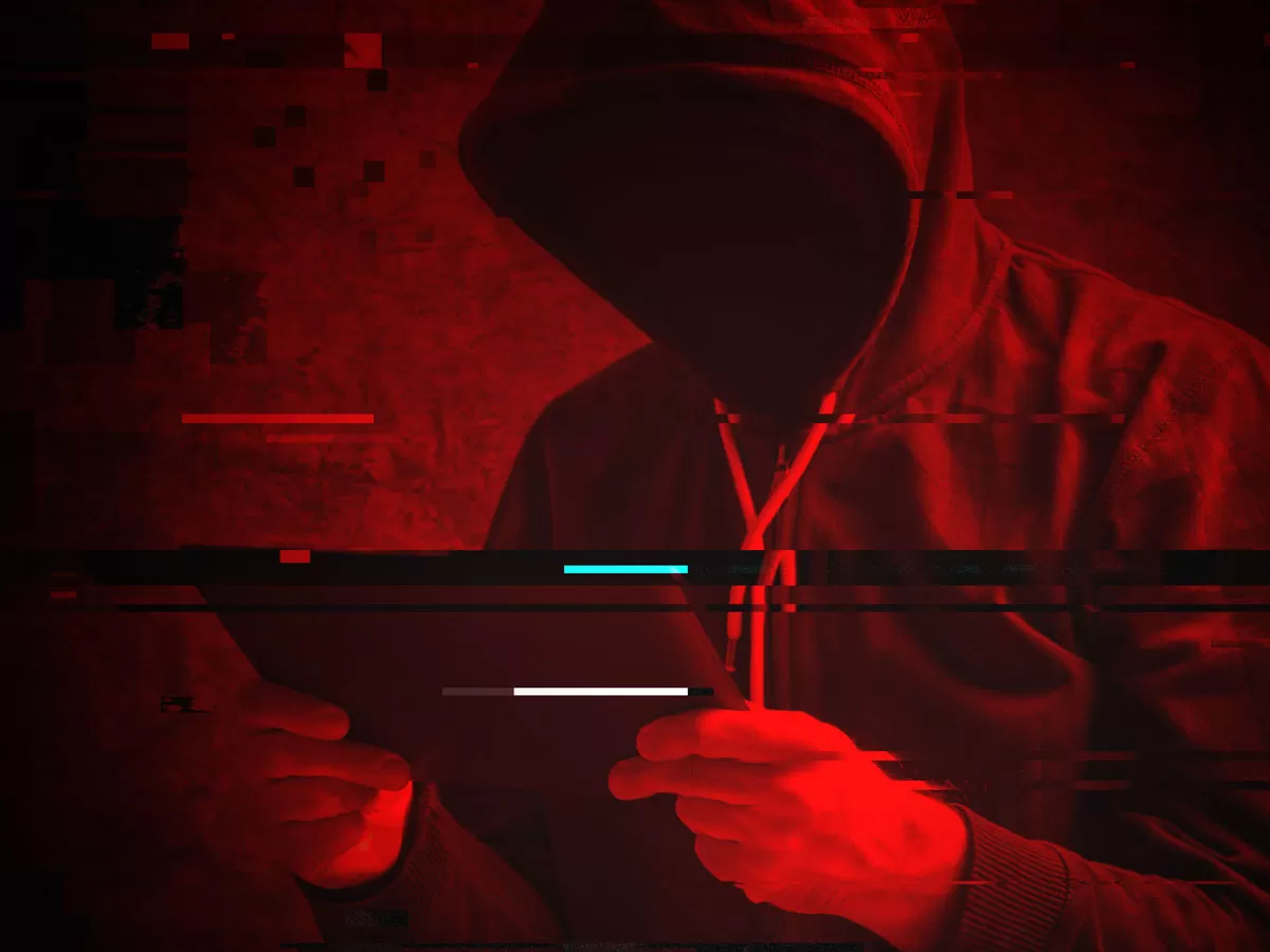 cybercriminal in hoodie hacking ecommerce website