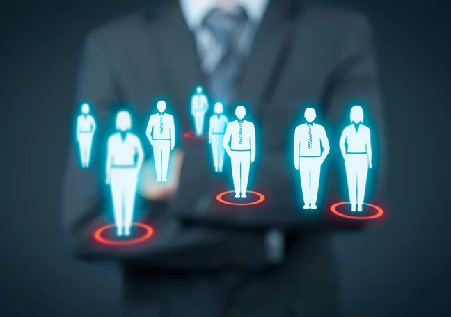 business executive standing with virtual interace crm human figures