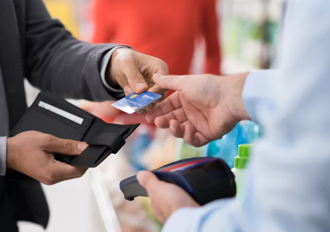 businessman purchasing paying for purchase with credit card