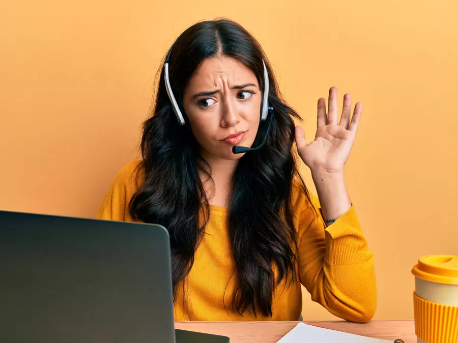 confused call center agent staring at laptop