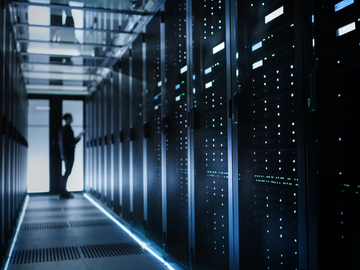 IT manager inspecting server in datacenter