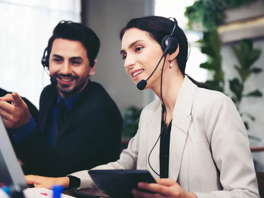 Enhancing Customer Experience depiction call center team leader helping teaching agent