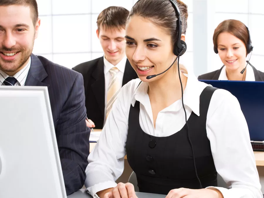 call center leader listening in watching customer service agent with consumer