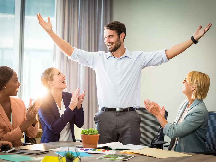 contact center team applauding high achiever 