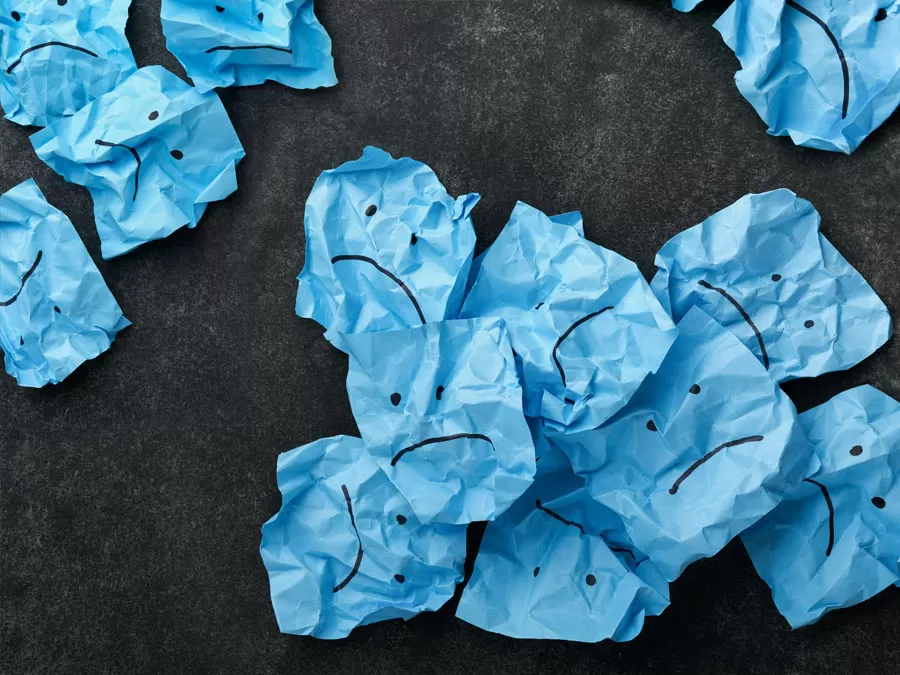 customer experience strategy needs updating blue crumpled paper trash sad face