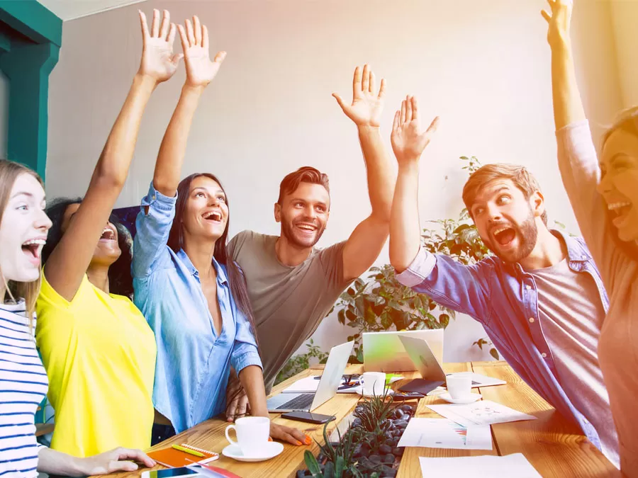 fun call centers in the Philippines reps raising hands laughing