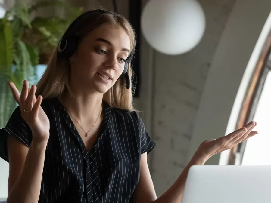 technical support agent speaking assisting customer on the phone