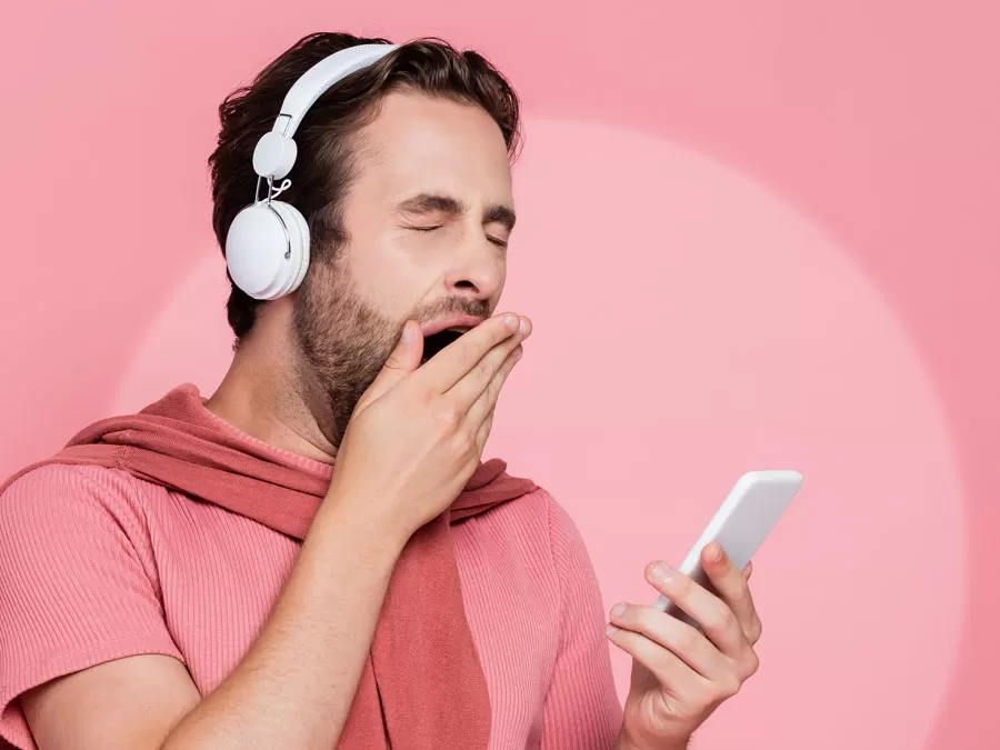 yawning man on phone with customer service